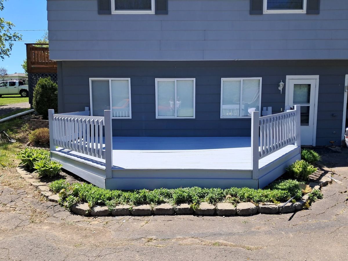 Same deck after full restoration with crisp white paint
