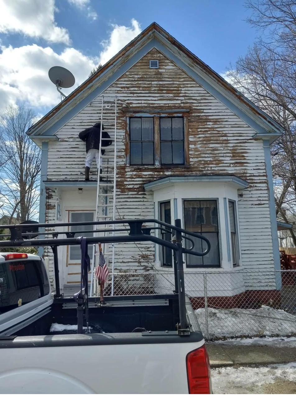 Severely peeling house before