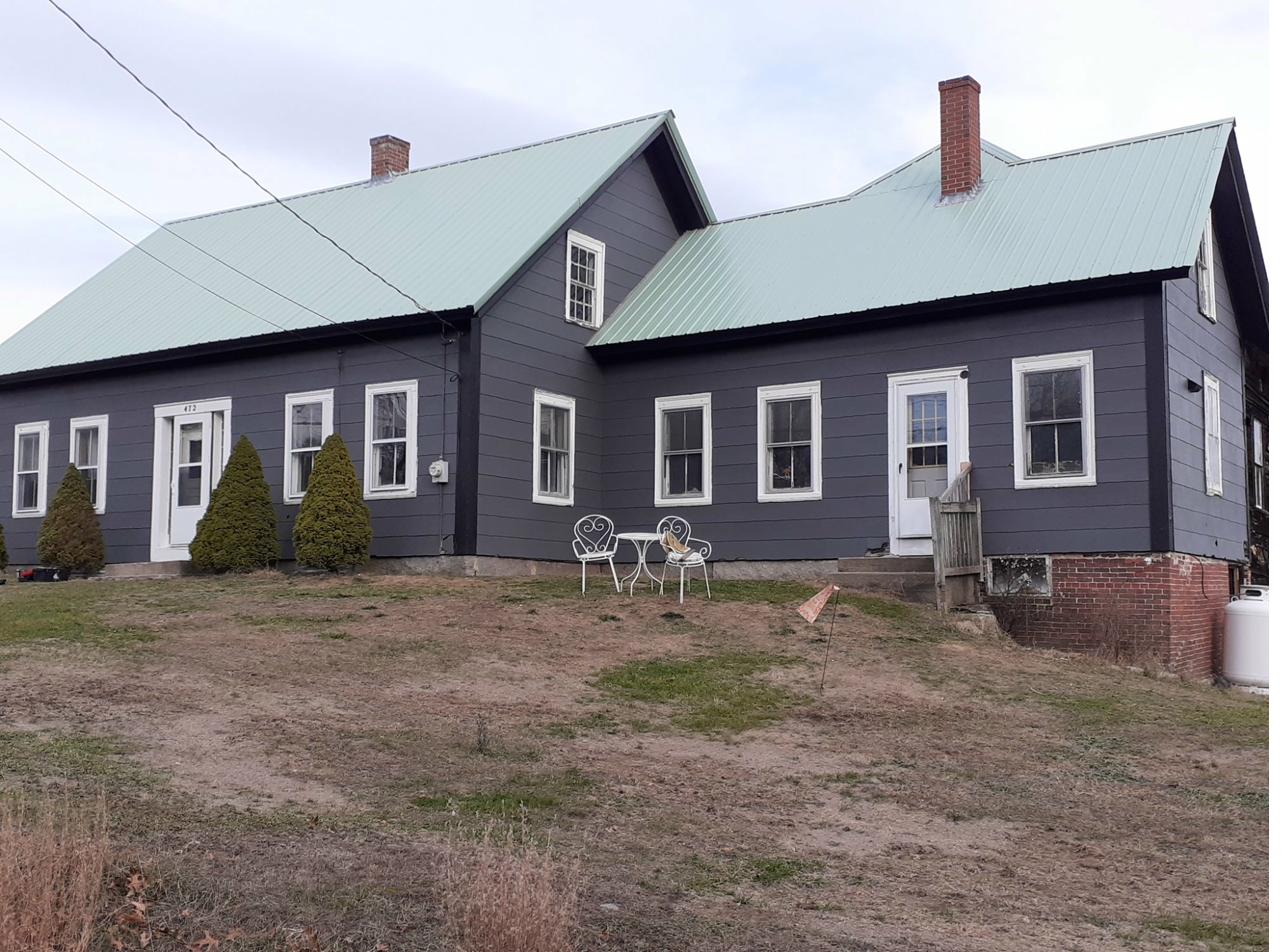 Dark gray painted house after