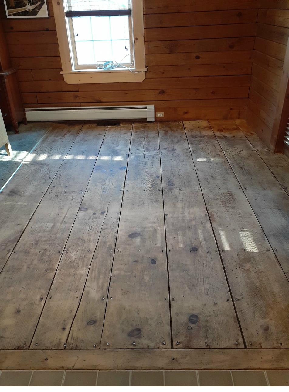 Worn wood floor before