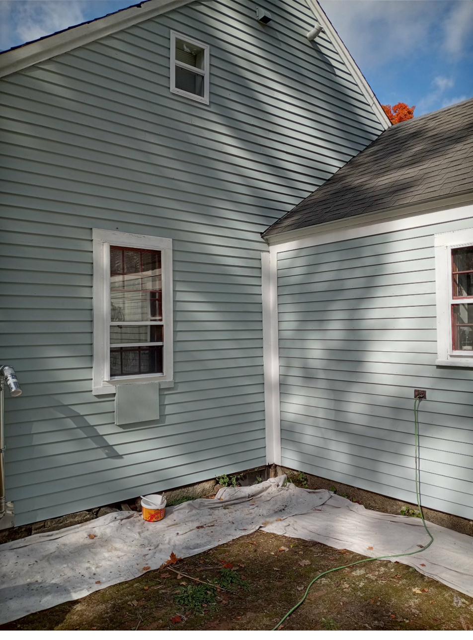 Yellow cottage exterior painting