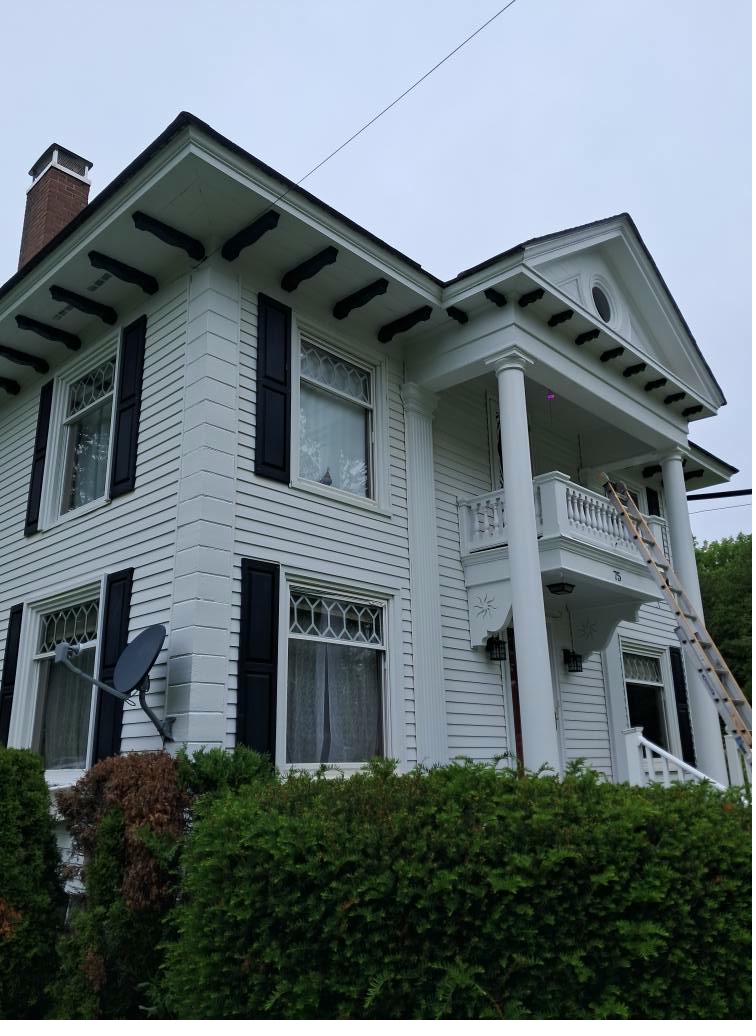 White colonial home exterior painting