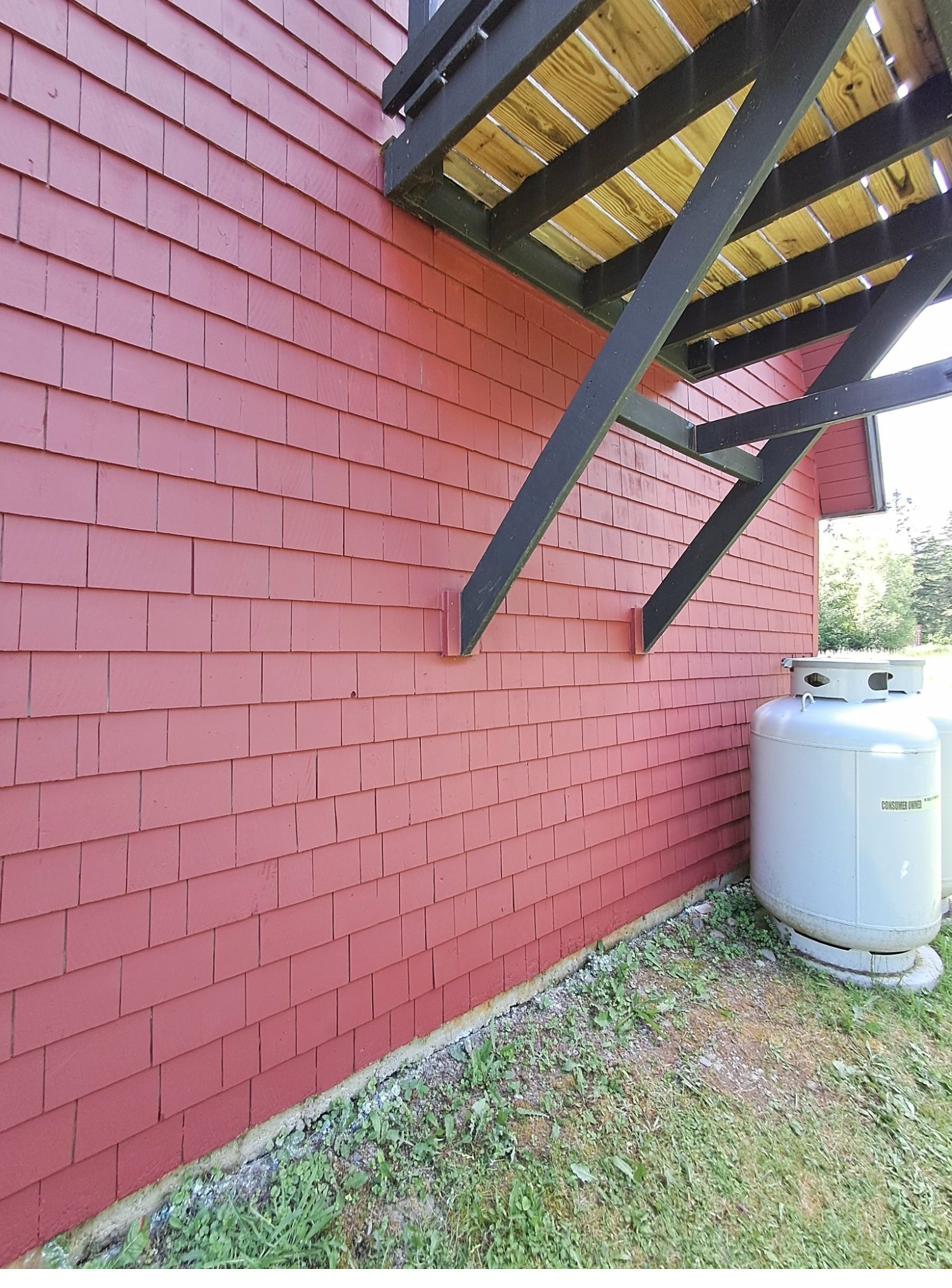 Green Victorian home exterior painting in Maine